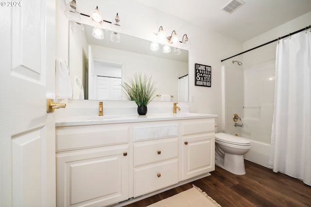 full bathroom with vanity, toilet, shower / tub combo with curtain, and hardwood / wood-style floors