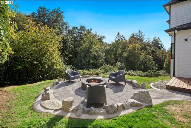 view of patio / terrace featuring an outdoor fire pit