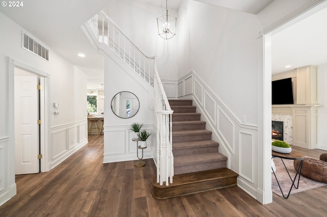 staircase featuring wood-type flooring