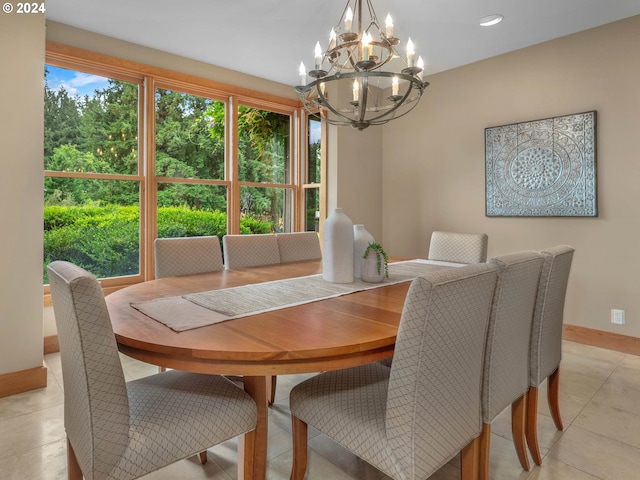 tiled dining area featuring a chandelier