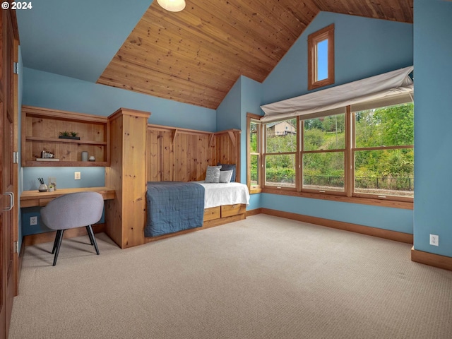 carpeted bedroom featuring vaulted ceiling and wooden ceiling