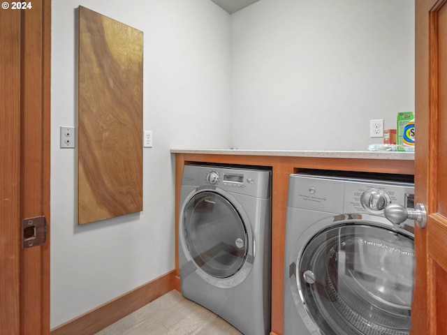 laundry room with washer and clothes dryer