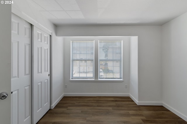 interior space with dark wood-type flooring