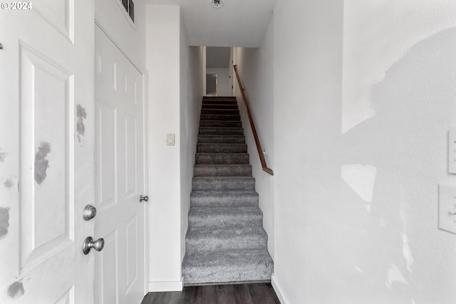 staircase featuring hardwood / wood-style floors