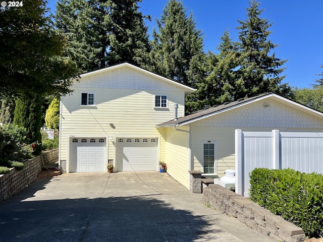 view of side of property with a garage