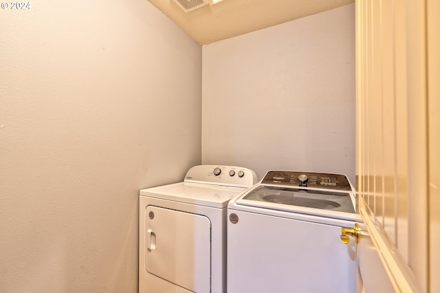 laundry room with washer and clothes dryer