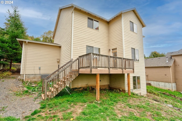 rear view of house with a wooden deck