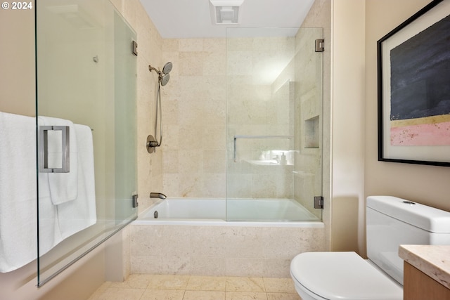 full bathroom with toilet, vanity, tile patterned flooring, and shower / bath combination with glass door