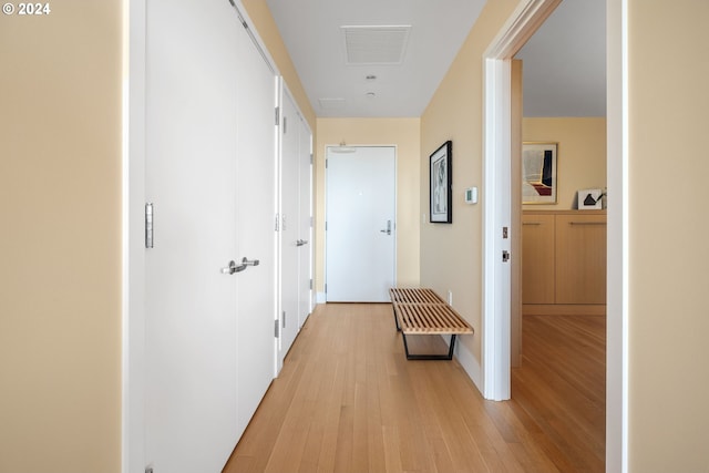 corridor with light wood-type flooring