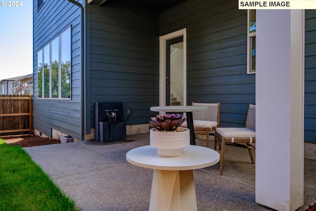 view of patio featuring fence