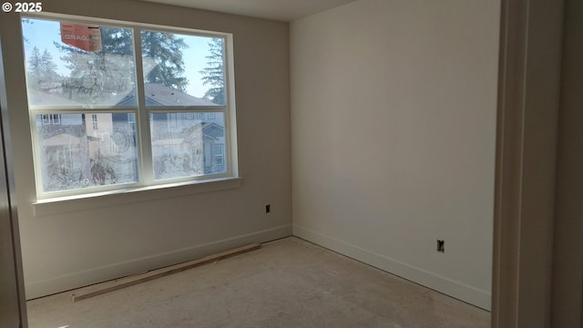 empty room featuring baseboards