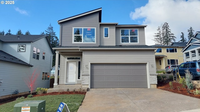 view of front of home with an attached garage and concrete driveway