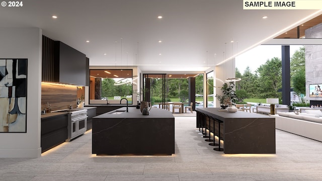 kitchen with floor to ceiling windows, a center island, double oven range, and sink