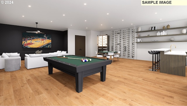 recreation room featuring light hardwood / wood-style floors, sink, and billiards