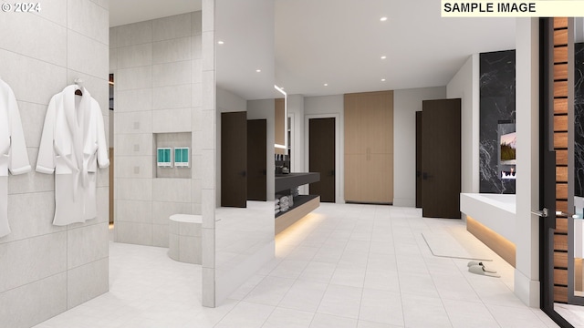 bathroom with tile patterned flooring and tile walls