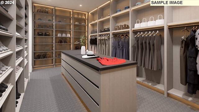 spacious closet with carpet flooring