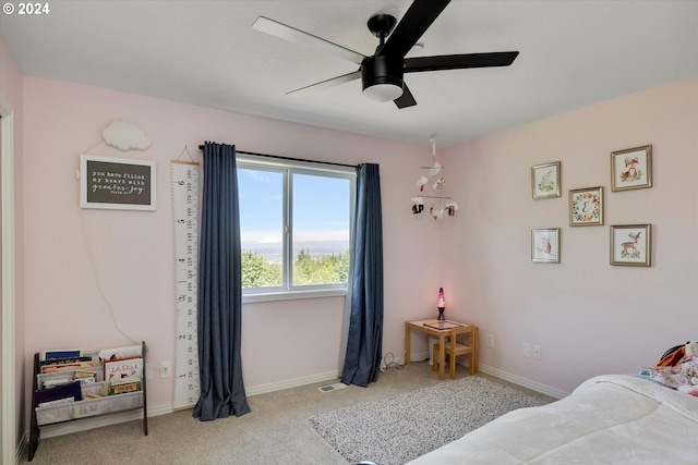 carpeted bedroom featuring ceiling fan