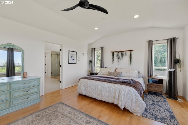 bedroom featuring ceiling fan, vaulted ceiling, and light hardwood / wood-style flooring