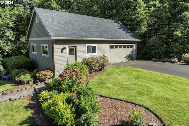 garage with a lawn