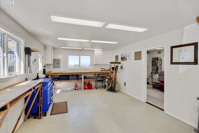 miscellaneous room featuring a workshop area and electric panel