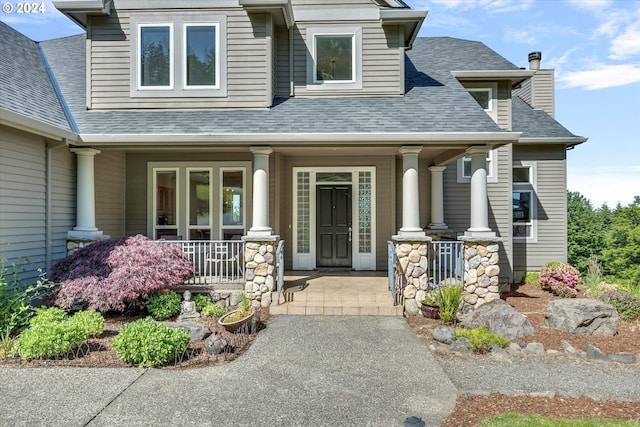 doorway to property featuring a porch