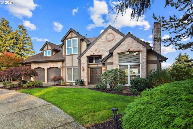 view of front of house featuring a garage and a front yard