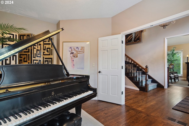 misc room featuring dark hardwood / wood-style floors and a textured ceiling