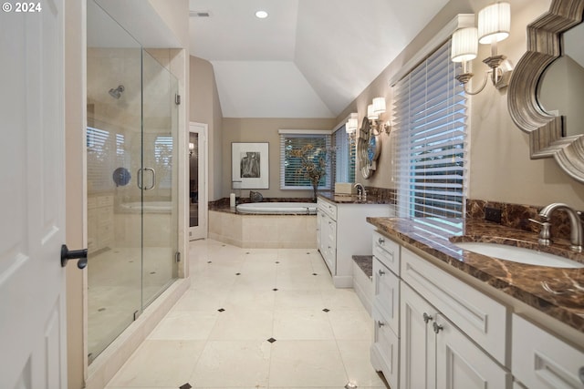 bathroom with tile patterned flooring, plus walk in shower, vaulted ceiling, and vanity