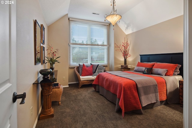 carpeted bedroom featuring vaulted ceiling