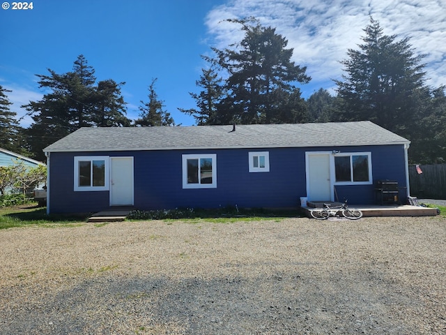 rear view of property featuring a patio area