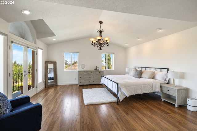 bedroom featuring lofted ceiling, multiple windows, a chandelier, and dark hardwood / wood-style floors