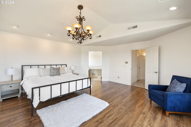 bedroom with dark hardwood / wood-style flooring, connected bathroom, vaulted ceiling, and a notable chandelier