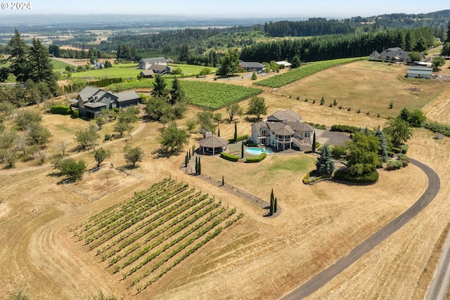 birds eye view of property with a rural view