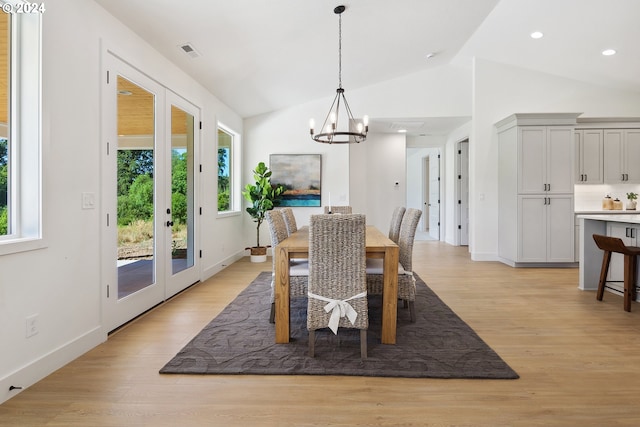 dining room featuring french doors, light hardwood / wood-style floors, and plenty of natural light