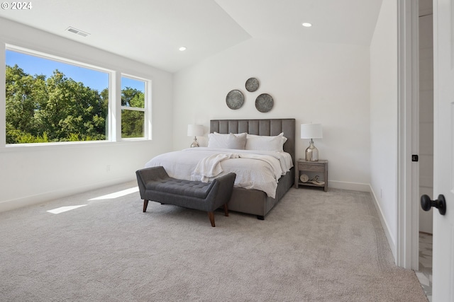 carpeted bedroom featuring lofted ceiling