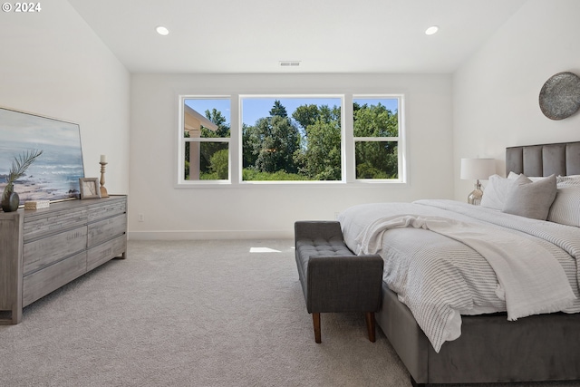 bedroom with light carpet