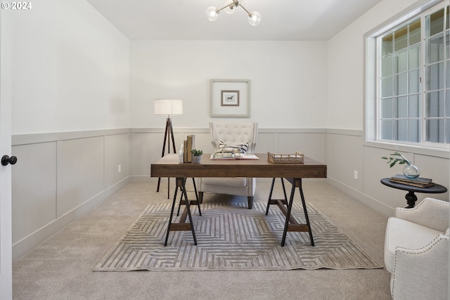 office area featuring carpet flooring and a chandelier