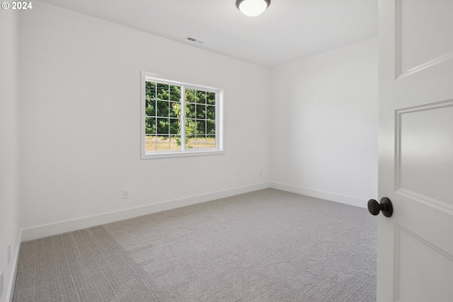 spare room featuring carpet floors