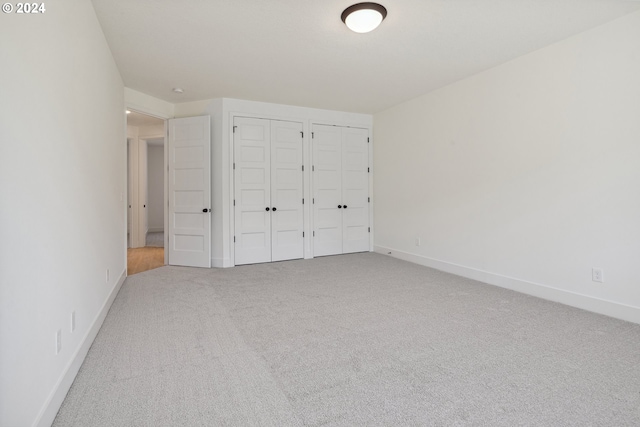 unfurnished bedroom with carpet floors