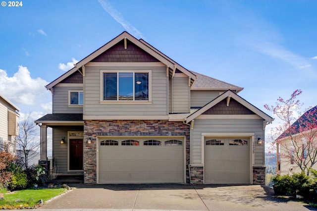 craftsman inspired home with a garage