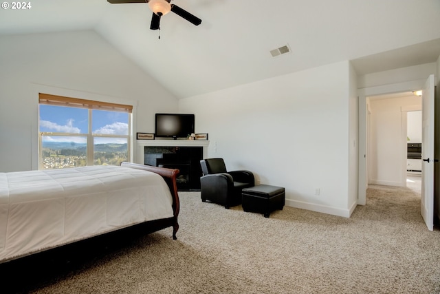 carpeted bedroom featuring high vaulted ceiling and ceiling fan