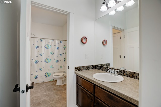 bathroom with tile flooring, tasteful backsplash, toilet, and vanity