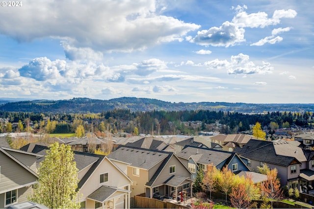 birds eye view of property with a mountain view