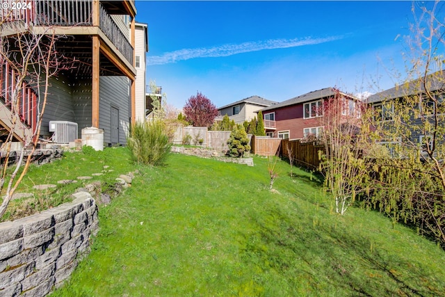 view of yard featuring central AC unit