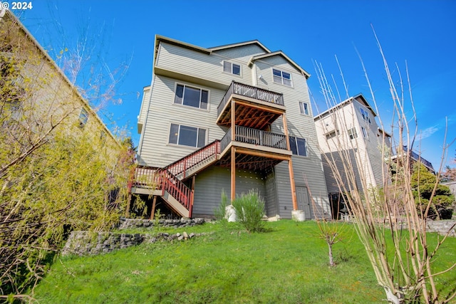 rear view of property featuring a yard