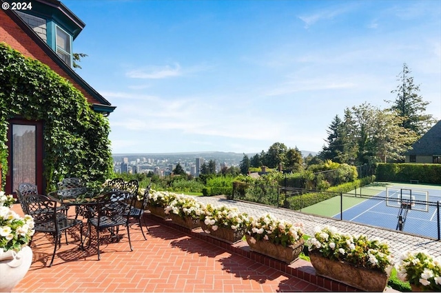 view of patio / terrace with tennis court