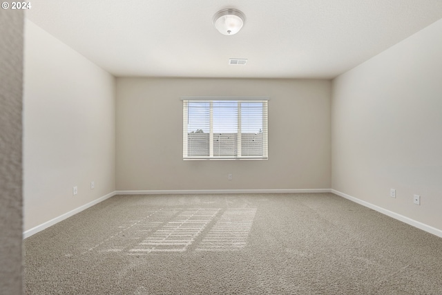 spare room with carpet floors