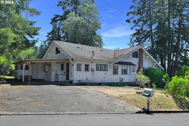 view of front of home with a carport