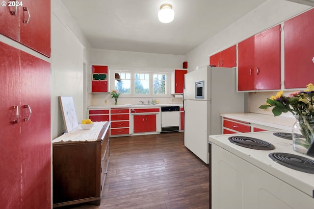 kitchen with dark hardwood / wood-style floors, white appliances, and sink