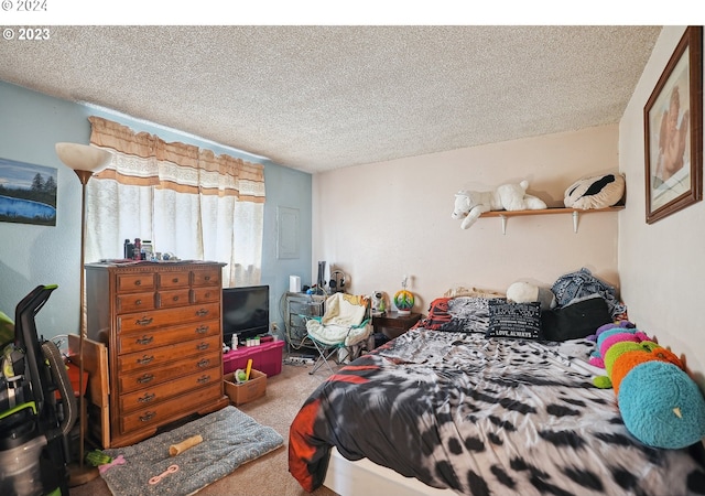 carpeted bedroom with a textured ceiling